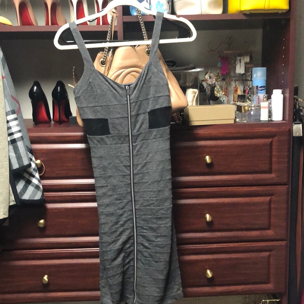 Form fitting grey dress. Mesh detailing
